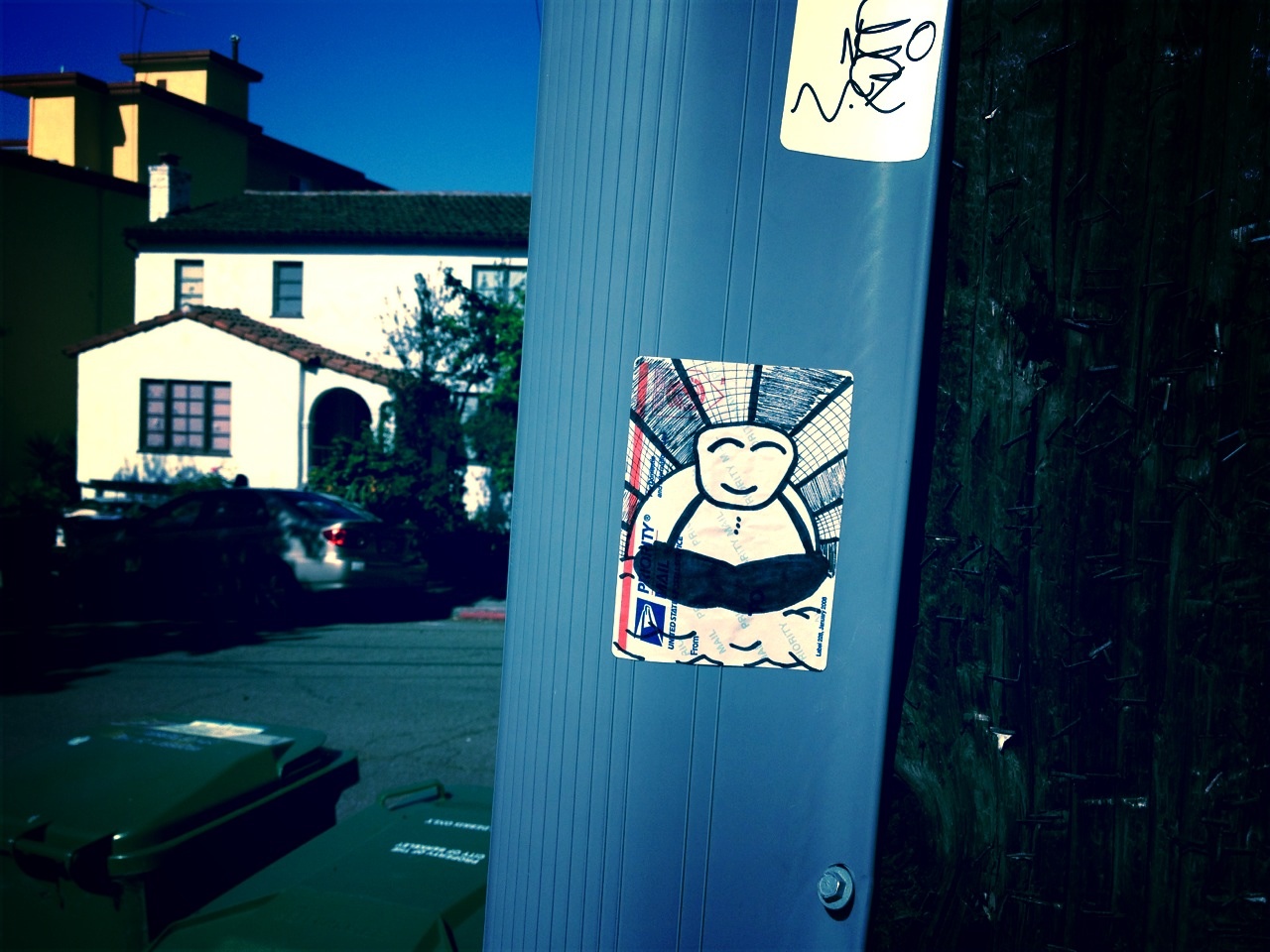 Random Buddha sticker on a telephone pole in Berkeley.